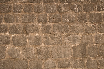 Background texture of the old fortress stone wall. Conceptual background for designers.