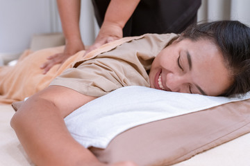 Woman relax with Thai traditinal body massage with therapist in salon spa