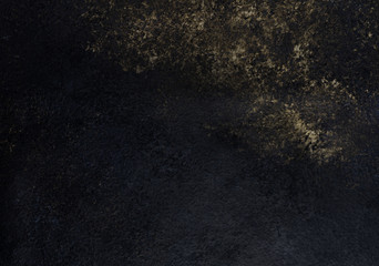 black textured background with a gold pattern