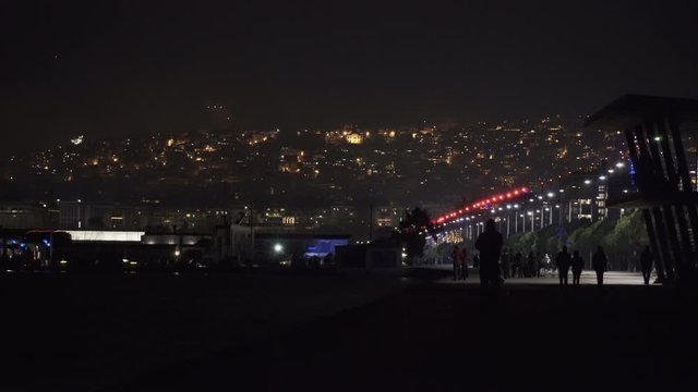 Series of fireworks above large residential area landscape at night. New Years Eve January 01 2020 pyrotechnics at Thessaloniki, Greece for the coming of New Year, seen from the city waterfront.