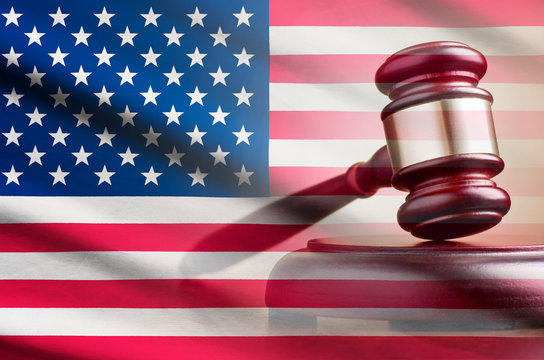 Legal gavel over a flag of the USA