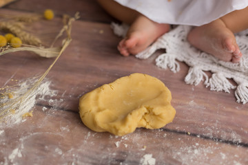 children's leg in the dough for baking. the child with the test