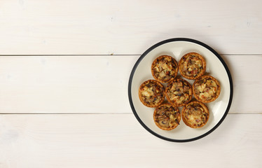 Julienne with mushrooms in tartlets on a plate