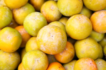 Lots of delicious looking very fresh peaches on sale at an outside market on a sunny Saturday. 