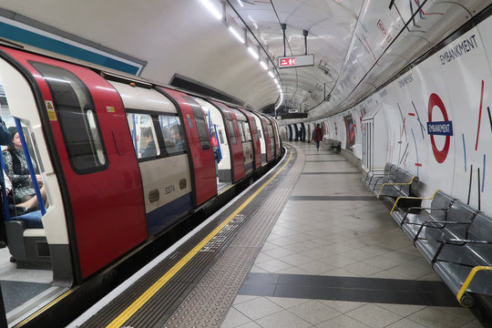 London, United Kingdom - October 14, 2018; Embankment metro platform in London, with a metro train waiting for departure