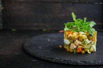 vegetable salad, traditional olivier (healthy eating potatoes, carrots, peas and more) menu concept. food background. top view. copy space