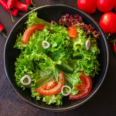 Healthy salad, leaves mix salad (mix micro greens, cucumber, tomato, chili pepper, other ingredients). food background. copy space