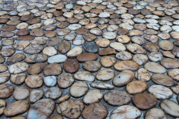 Area paved with stones of many colors. Walking foot comfort Soft to the touch.