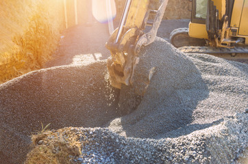 Loading of stone excavator works in gravel pit