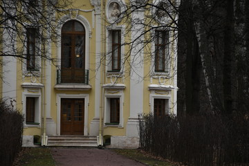 facade of an old building. yellow building fa&ccedil;ade. sculptures and decorative elements on the facade of buildings.
