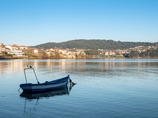 boat on calm waters in Combarro