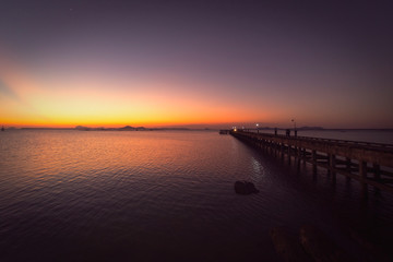 Fototapeta na wymiar bridge and sea sunset