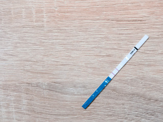 A pregnancy test showing a positive result. copy space