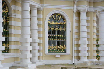 facade of an old building. yellow building fa&ccedil;ade. sculptures and decorative elements on the facade of buildings. palace in moscow Russia.
