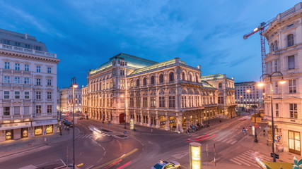 Naklejka na ściany i meble Beautiful view of Wiener Staatsoper aerial day to night timelapse in Vienna, Austria
