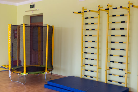 A Wall With Ladder Bar For Fitness Training Inside Sports Gym Room In A School.