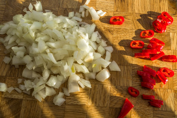 Obraz na płótnie Canvas Sliced Vegetables Wooden Cutting Board Red Chilli Onion