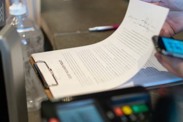 Contract or agreement with signatures at hotel