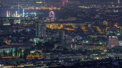 Fototapeta premium Skyline of Vienna from Danube Viewpoint Leopoldsberg aerial night timelapse.