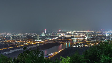 Skyline of Vienna from Danube Viewpoint Leopoldsberg aerial night timelapse.
