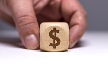 Pictogramme dollar / économie sur cube en bois