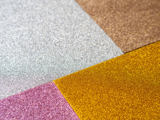 Different color glitter sparkle foam close up mosaic still life