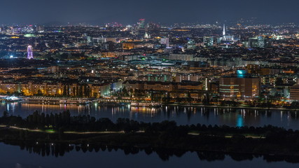 Aerial panoramic view over Vienna city with skyscrapers, historic buildings and a riverside...