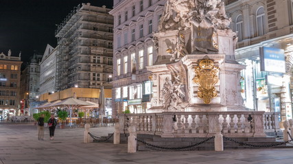People is walking in Graben St. night timelapse, old town main street of Vienna, Austria.