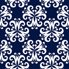 Floral seamless background. White pattern on dark blue backdrop