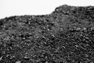 A heap of black natural coal, photo of coal mine background, texture