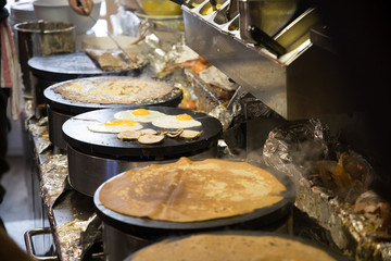 French chef cooking traditional galette in Rennes ,France.