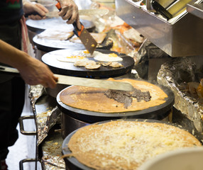 French chef cooking traditional galette in Rennes ,France.