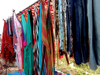urban indian women scarf stall roadside.