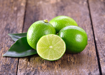Lime on wooden background