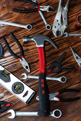 Close up tools on a wooden background.