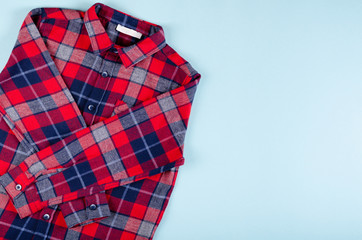 Obraz premium Textile, shirt composition on color background. Flat lay.