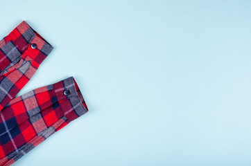 Fototapeta premium Textile, shirt composition on color background. Flat lay.