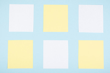 Paper notes composition on blue background. Flat lay.