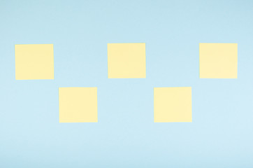 Paper notes composition on blue background. Flat lay.