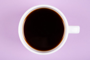 Coffee cup composition on purple background. Flat lay.