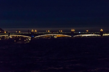 Night view of Trinity bridge from the Neva river in St. Petersburg, Russia
