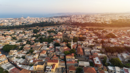 View of Streets of the Rhodes old town at sunset. Top down aerial view on the roofs of Greek houses. Greece.