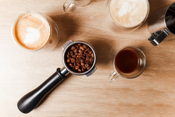Three cup of coffee with step by making coffee with bean on the table. Copy space