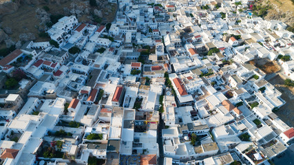 Traditional historic Greek white houses with beautiful roofs. Top down view. Lindos, Greece.