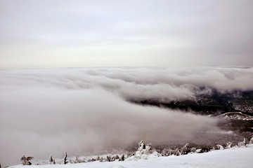 winter mountain landscape with fog and mountains