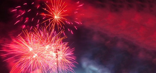 Ultra wide panoramic night shot of beautiful slow shutter fireworks as seen during festive celebration