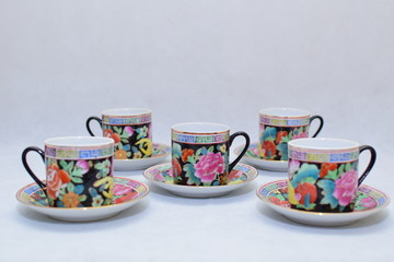 Mock up / design set of elegant and traditional colorful coffee cup & Tea cup on cup's plate , drink-ware , kitchen isolated on white background 