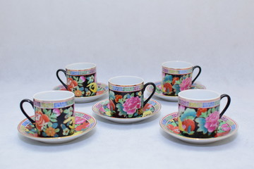 Mock up / design set of elegant and traditional colorful coffee cup & Tea cup on cup's plate , drink-ware , kitchen isolated on white background 