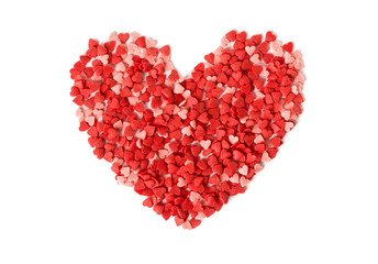 Fototapeta na wymiar heart shape made from candy hundreds and thousands sprinkles on a white background