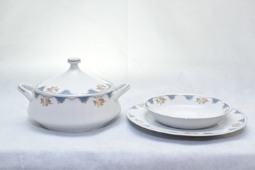 Mock up / design set of elegant and traditional  colorful white and blue dishware and dork knife spoon  , design/ dining-ware and food plates and bowl isolated on white background